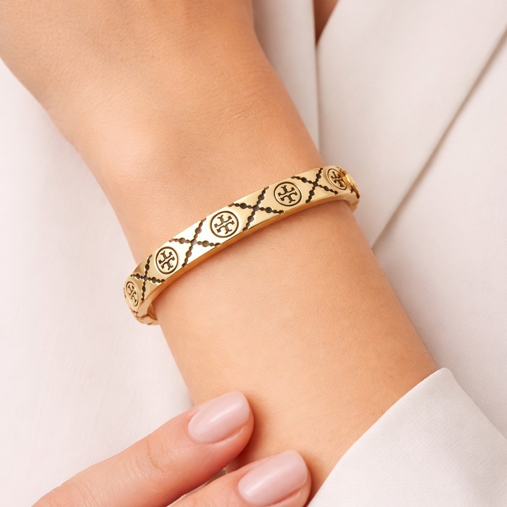 Tory Burch Monogram enamel miller stud hinge bracelet in black and gold tone. - Picture 2 of 7